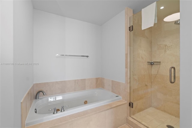 bathroom with shower with separate bathtub