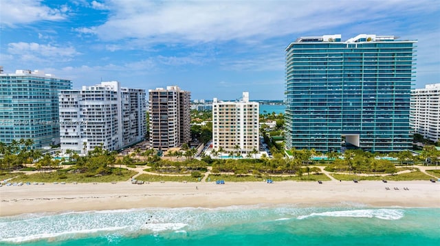 bird's eye view with a beach view and a water view