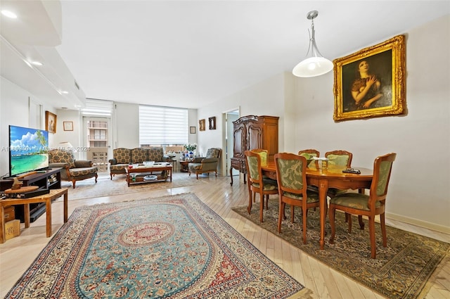 dining area with light hardwood / wood-style flooring