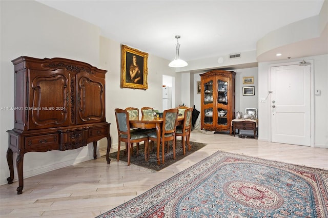 dining room with light hardwood / wood-style floors