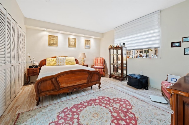 bedroom featuring light hardwood / wood-style floors and a closet