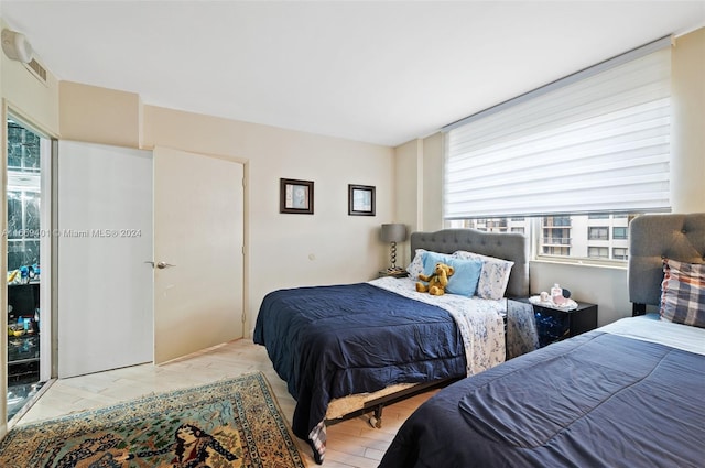 bedroom with light hardwood / wood-style floors