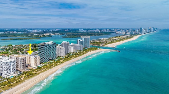 aerial view featuring a view of the beach and a water view