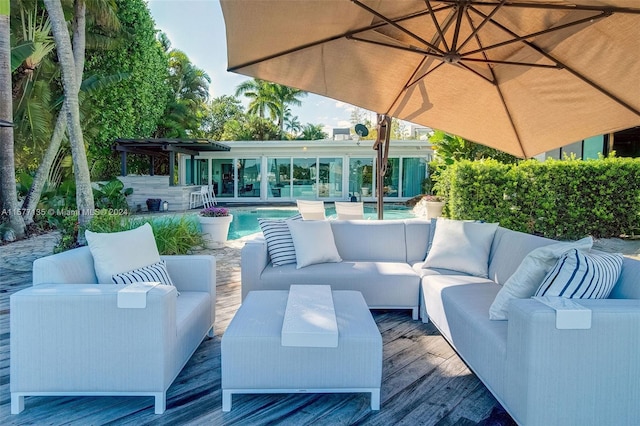 view of patio / terrace with outdoor lounge area and a deck