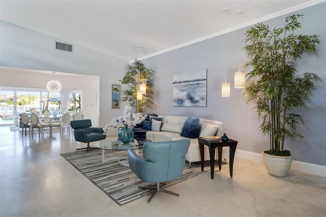 living room with crown molding and a chandelier