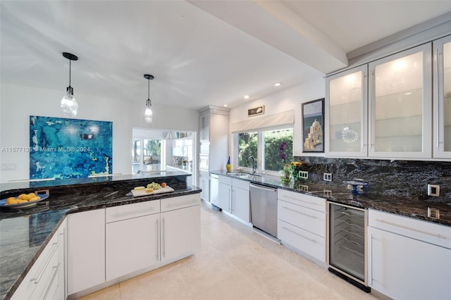 kitchen featuring tasteful backsplash, white cabinets, pendant lighting, wine cooler, and dishwasher