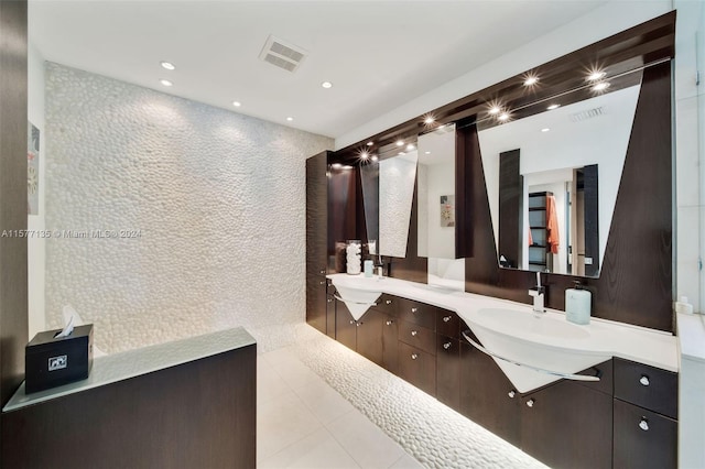 bathroom with tile patterned flooring and vanity