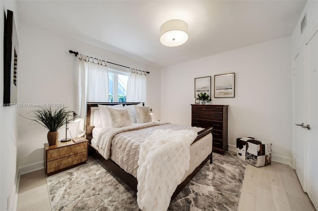 bedroom featuring light wood-type flooring