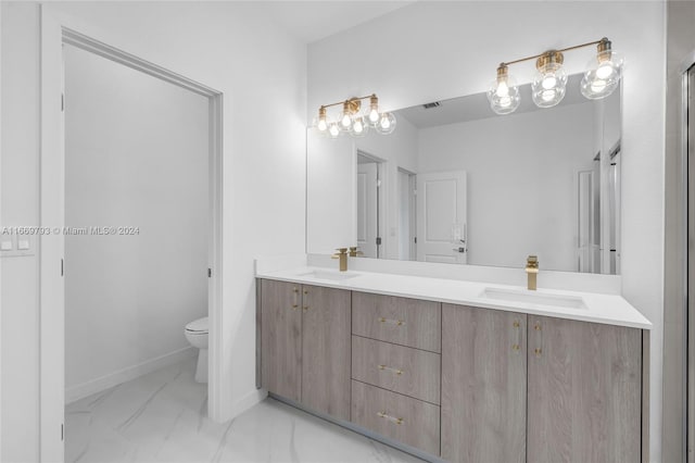 bathroom with vanity and toilet