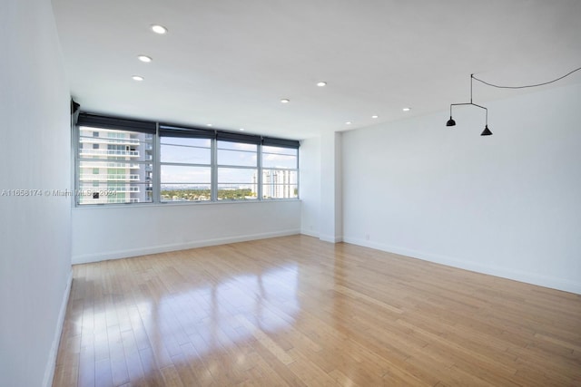 spare room featuring light wood-type flooring