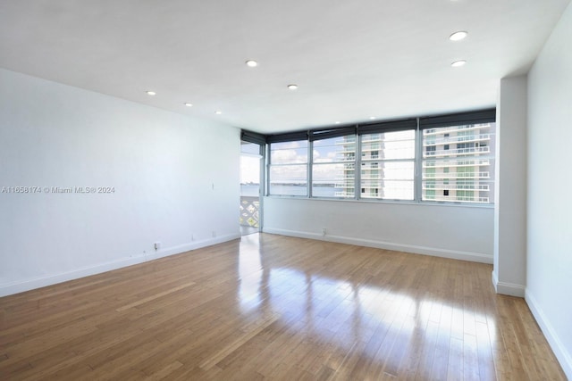 unfurnished room featuring light hardwood / wood-style floors