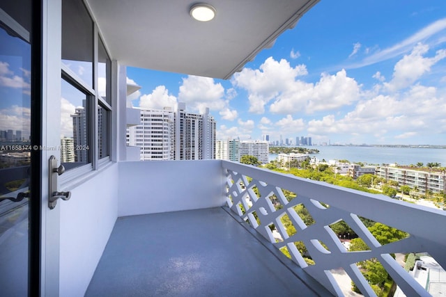 balcony featuring a water view