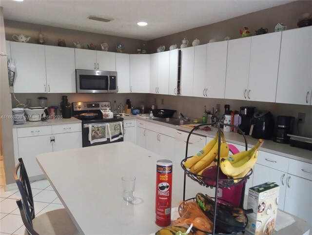 tiled dining area with lofted ceiling