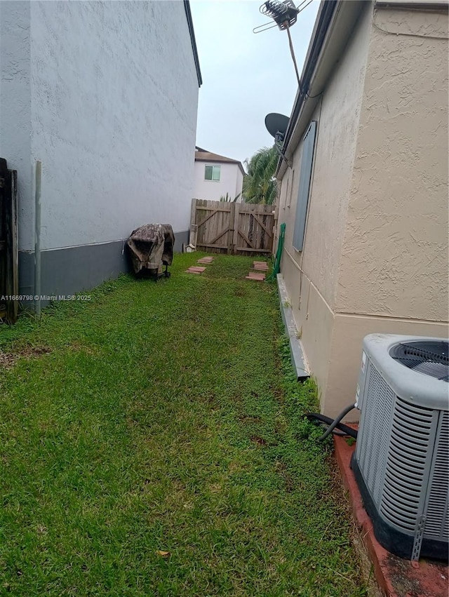 view of yard featuring central AC