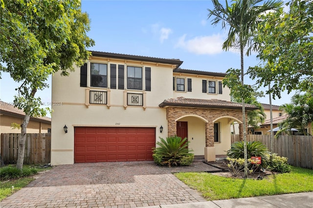 mediterranean / spanish-style home featuring a garage