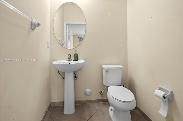 bathroom featuring tile patterned flooring and toilet