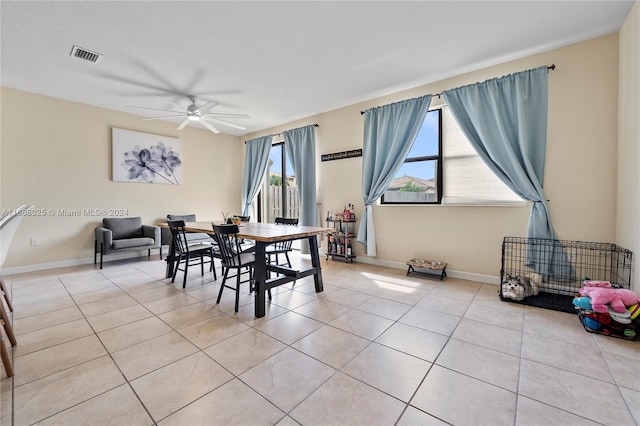 dining room featuring light tile patterned flooring and ceiling fan