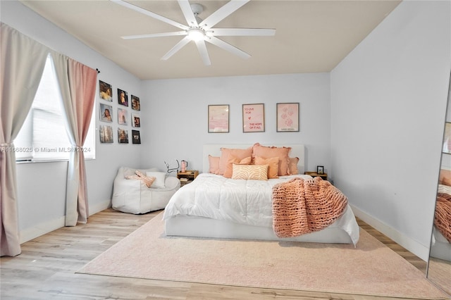 bedroom featuring ceiling fan and light hardwood / wood-style flooring