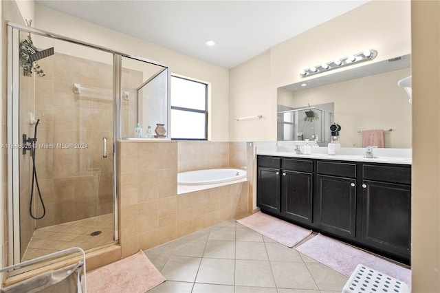 bathroom with vanity, tile patterned floors, and shower with separate bathtub