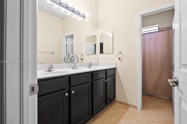 bathroom featuring tile patterned flooring and vanity