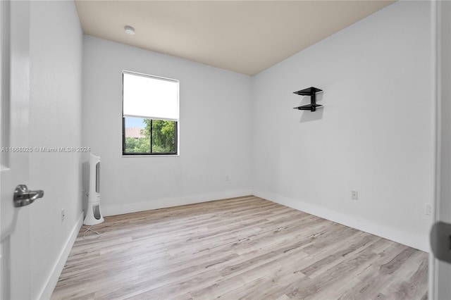 empty room with light hardwood / wood-style floors