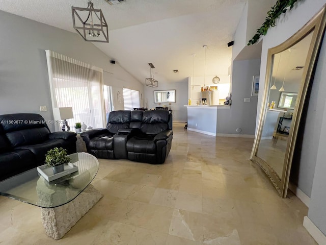 living room with a textured ceiling, a chandelier, and high vaulted ceiling