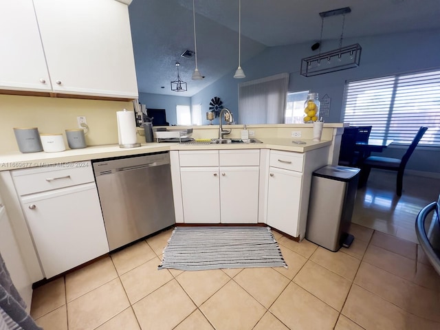 kitchen with vaulted ceiling, white cabinets, dishwasher, decorative light fixtures, and sink