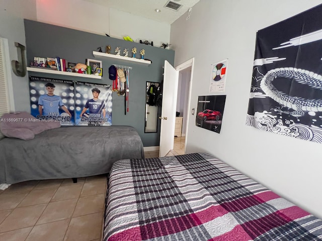 bedroom with tile patterned floors