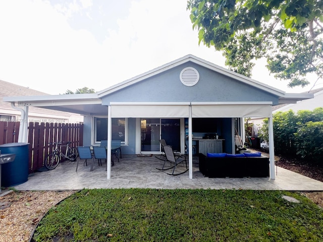 rear view of house featuring a patio area