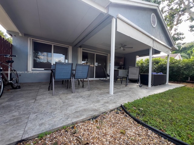 view of patio featuring ceiling fan