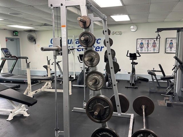 workout area featuring a paneled ceiling