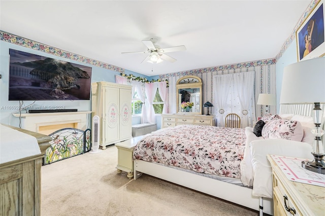 carpeted bedroom featuring ceiling fan