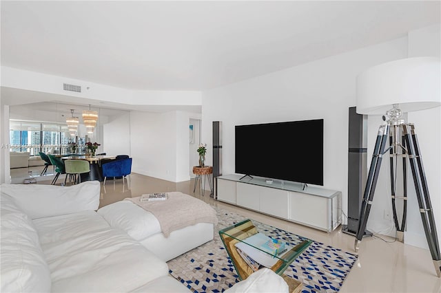 living room with a notable chandelier