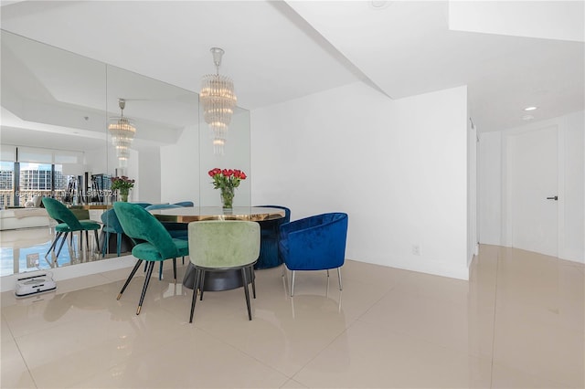 dining area featuring light tile patterned floors and a chandelier