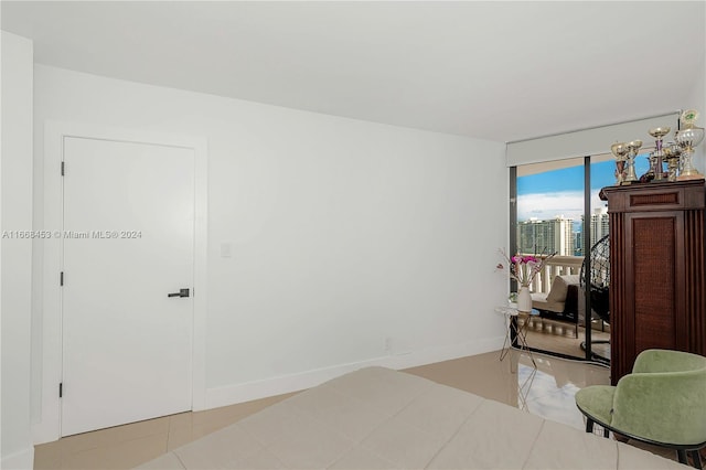 bedroom with light tile patterned floors