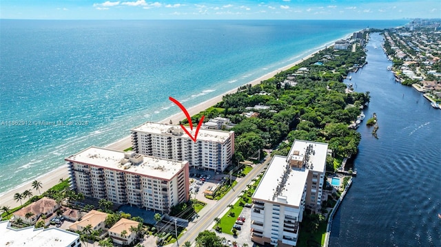 aerial view featuring a view of the beach and a water view