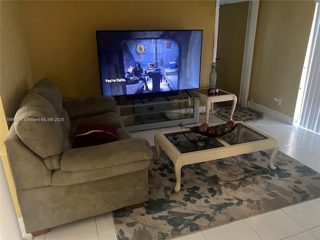 living area featuring baseboards and tile patterned floors