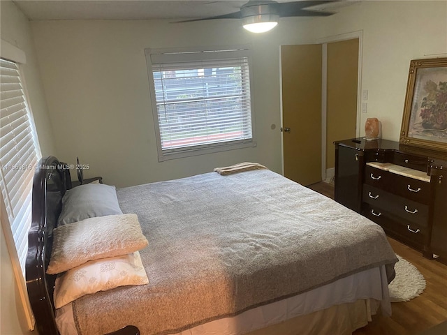 bedroom featuring ceiling fan and wood finished floors