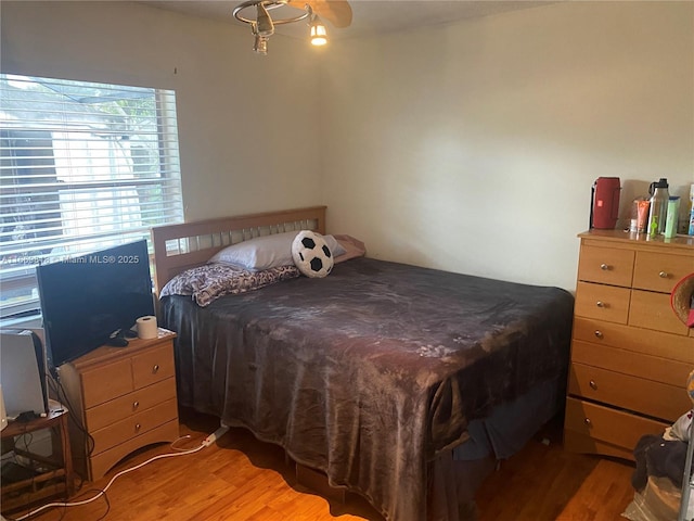 bedroom with light wood finished floors