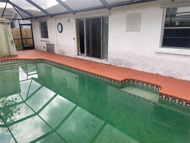 pool with a patio and a lanai