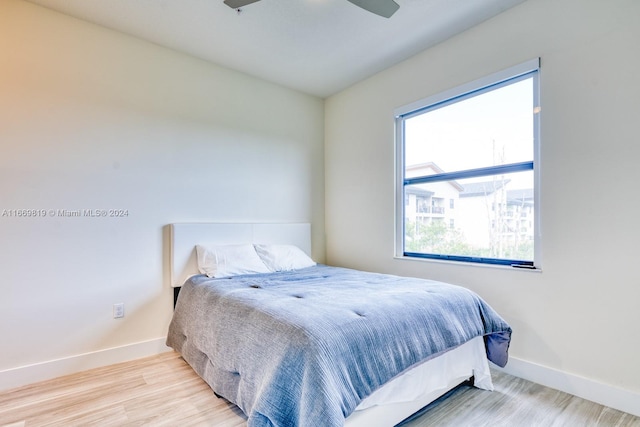 bedroom featuring light wood-type flooring and ceiling fan