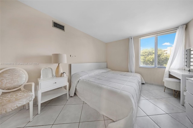 bedroom featuring light tile patterned floors