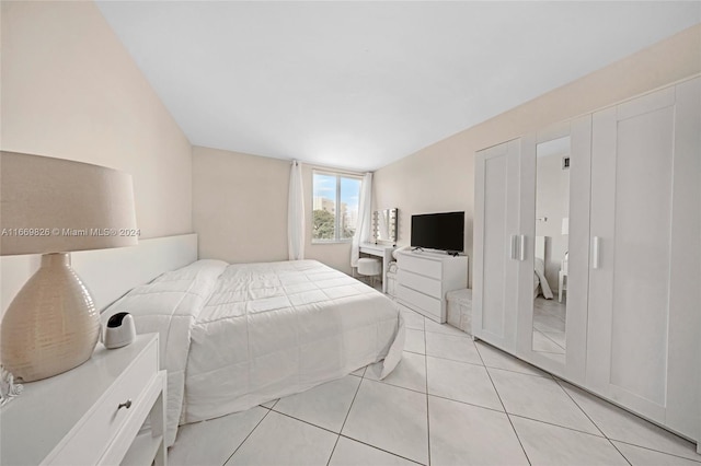 bedroom with light tile patterned floors