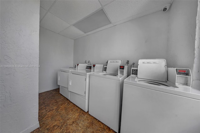 laundry room featuring dark wood-type flooring and separate washer and dryer