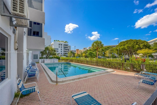 view of swimming pool featuring a patio area