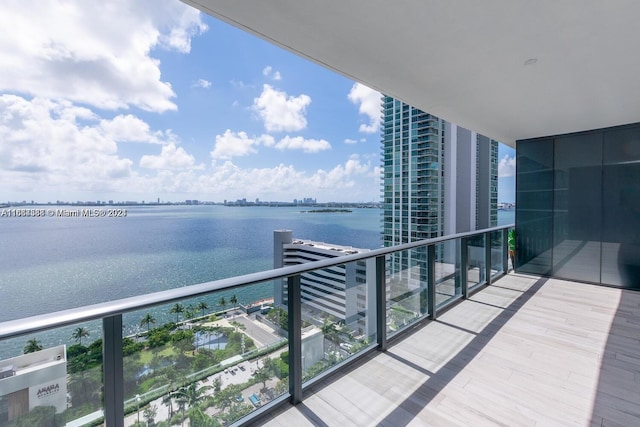 balcony featuring a water view