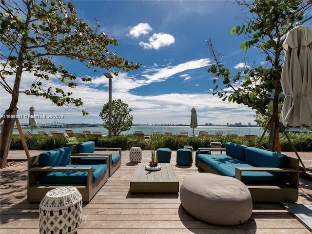 wooden deck with a water view