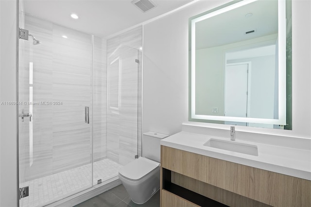 bathroom featuring vanity, toilet, an enclosed shower, and tile patterned floors