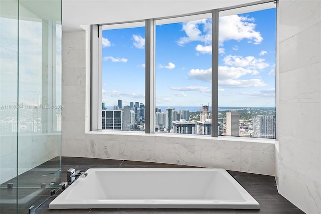 bathroom with tiled bath