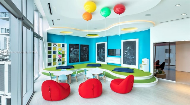 playroom with light hardwood / wood-style flooring